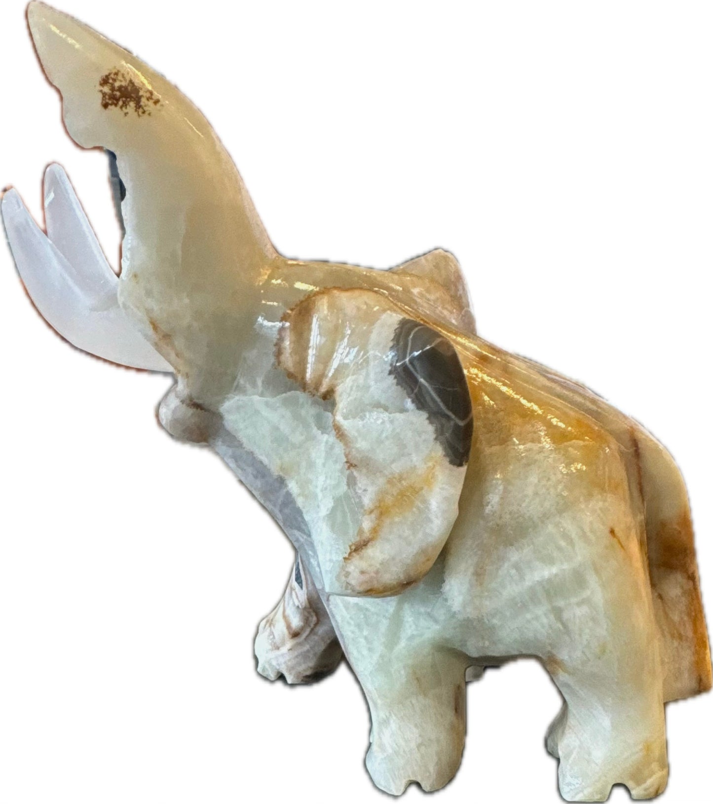 Large sculpture of an elephant carved from striped green onyx.